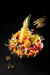 Exotic Fruit Assortment with Berries and Pineapple on Elegant Presentation Dish - 788217927