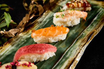 Assorted Nigiri Sushi with Salmon, Tuna, Shrimp, Eel, and Scallop on Elegant Plate - 788218349