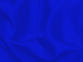 Blue silk  fabric texture with irregular folds. Abstract background. 