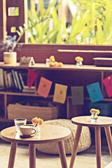 Traditional Bali style cozy cafe or coffee shop tables in Ubud, Bali, Indonesia