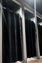 Row of Black Shower Curtains in a Bathroom - 788220146