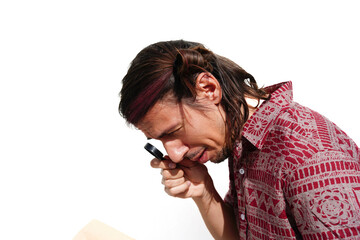A blind man with modern hairstyle is looking through a magnifying glass.