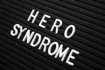 The letter board displays the words hero syndrome