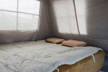A temporary casual outdoor tent bedroom display