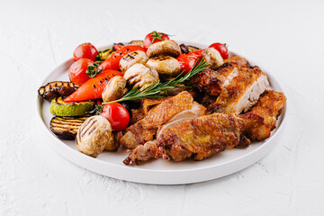 Roasted chicken dinner with grilled vegetables