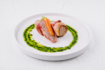 Gourmet pork tenderloin with carrot and pesto sauce