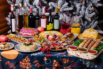 Festive holiday dinner table spread with various dishes
