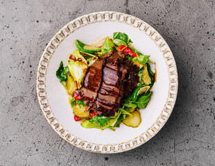 Gourmet steak salad on decorative plate