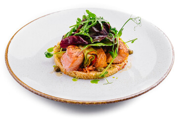 Gourmet salmon dish on white background