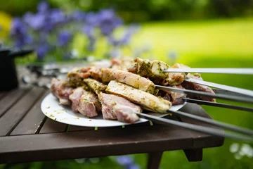  Chicken kabobs grilled on skewers outdoors. Summer activities. © MNStudio