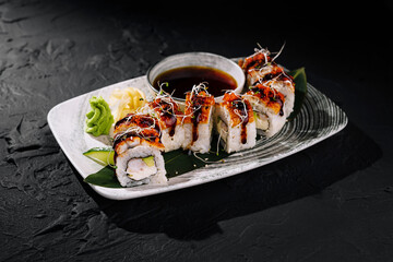 Delectable sushi roll platter with soy sauce