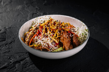 Asian beef stir fry with noodles and vegetables