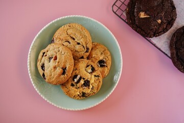 Homemade chewy chocolate chip cookies with glass of milk, selective focus