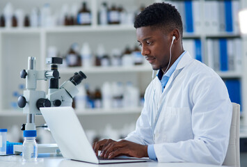 Science, man and laptop in lab with research for medical study, microscopic experiment or DNA...