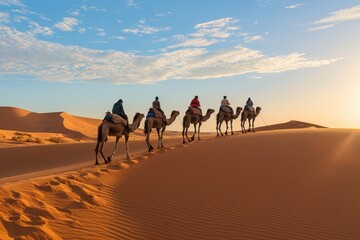 Caravan journey at sunset through sahara desert