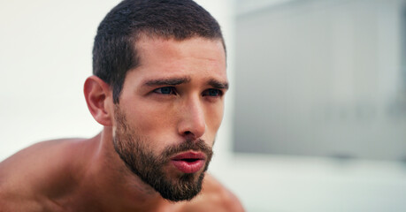 Thinking, tired and man outdoor for workout, health and fitness in city for wellness on mockup space. Sports, face and person on break with fatigue, breathing and relax after training for exercise