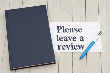 Please leave a book review with retro old blue book with index card and pen - 788257729