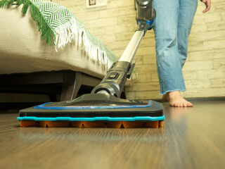 girl cleaning the house, vacuuming the floor
