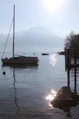 Vertical shot of a boat docked at the sea on a hot summer day