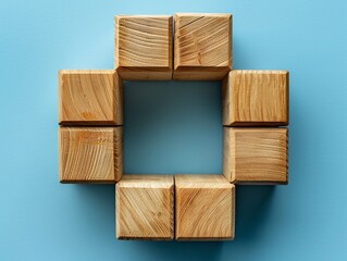 Artistic display of wooden blocks interconnected, showcased on an azure backdrop, representing team collaboration