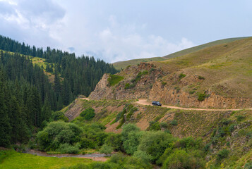 Mountain road with car. Beautiful nature of Kazakhstan near Almaty