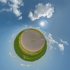 simple tiny planet without buildings in blue sky with beautiful clouds. Transformation of spherical panorama 360 degrees. Spherical abstract aerial view. Curvature of space. - 788277341