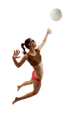 Dynamic shot of athletic woman, professional beach volleyball strike ball in motion against white background. Concept of sport games, movement, championship, power and strength, dynamic and energy.