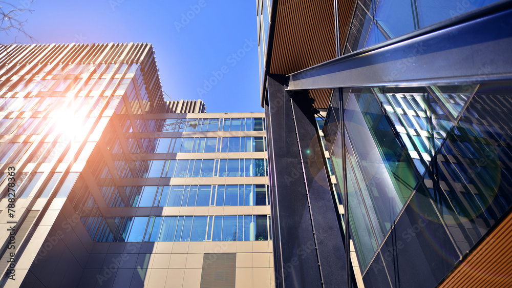 Sticker Steel and glass. The subject of modern architecture or construction industry. Modern office building facade with tall steel construction elements and full height windows between.