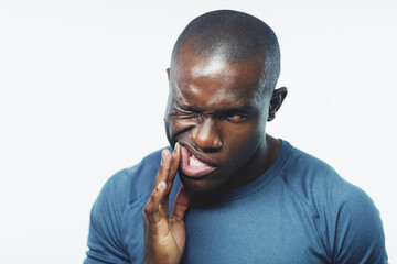 Toothache, pain and black man on a white background for dental crisis, gum disease or inflammation....