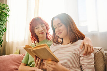 happy lesbian couple enjoying quiet moment of reading together, wrapped in love and comfort - Powered by Adobe