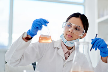 Science, woman and glass of chemical in lab for research, investigation and scientific experiment....