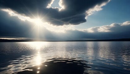 Sun beams coming out of the clouds in a lake creating a reflection..