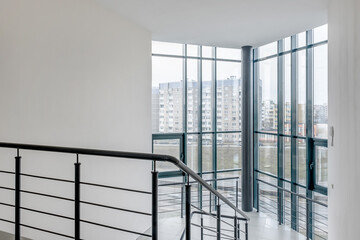 panorama view in empty modern hall with columns, doors, stairs and panoramic windows - 788298511