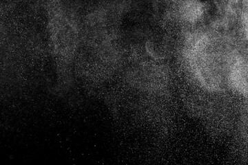 White texture on black background. Dark textured pattern. Abstract dust overlay. Light powder explosion.	
