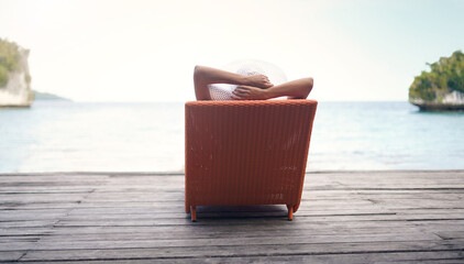 Travel, vacation and relax in beach, chair and holiday for summer, person and blue sky in nature....