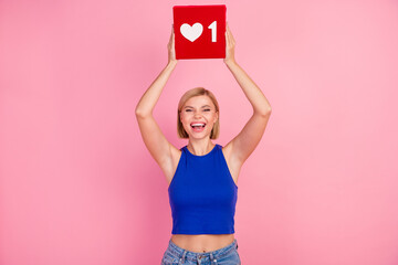 Photo of pretty young woman hands hold like icon wear blue top isolated on pink color background - obrazy, fototapety, plakaty
