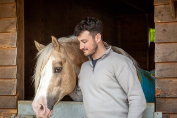 Man with a horse, Image shows a 28 year old bearded male posing with a section D Welsh cob pony,...