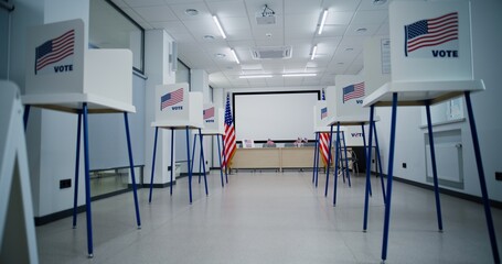National Election Day in the United States of America. Dolly shot of voting booths with American flag logo in polling station office. Political races of US presidential candidates. Democracy concept. - obrazy, fototapety, plakaty