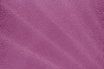 Texture of corrugated pink glass. Abstract natural background.