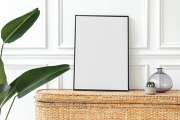 Picture frame mockup png on a rattan chest