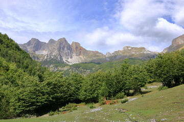 Fototapeta na wymiar Panoramic view of raw mountain landscapes from the Albanian Alps between Theth and Valbona, Albania