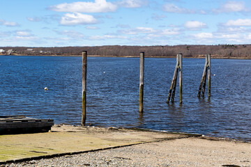 End view of the boat ramp at Stockton Springs harbor in the spring with no additional floats in the water. - 788346798