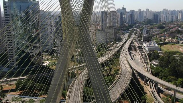 Aerial view of Octavio Frias de Oliveira Bridge - Ponte Estaiada - over Pinheiros River, Sao Paulo, Brazil This image is perfect for projects related to events, travel and tourism.	
