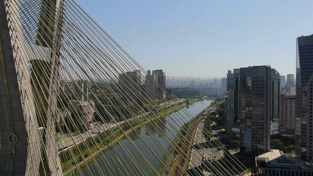 Aerial view of Octavio Frias de Oliveira Bridge - Ponte Estaiada - over Pinheiros River, Sao Paulo, Brazil This image is perfect for projects related to events, travel and tourism.	
