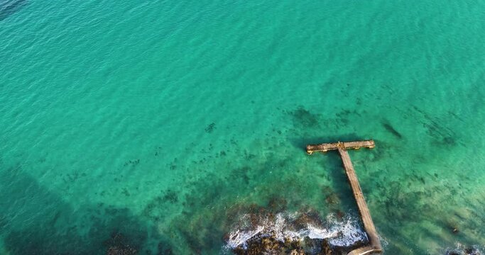 pier of calla millor with tropical water 