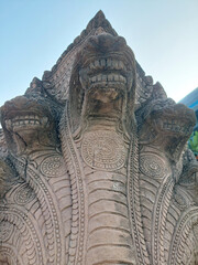 Naga stone statue is located along the Bang Pakong river in Chachoengsao province, Thailand.