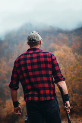 Handsome Strong Young Man in Plaid Shirt in Autumn Forest - 788363761