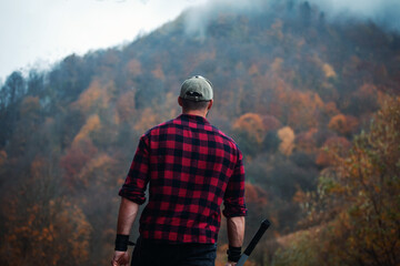 Handsome Strong Young Man in Plaid Shirt in Autumn Forest - 788363794