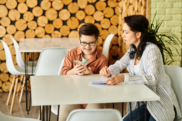 good looking mother in casual clothes with inclusive son with Down syndrome looking at menu on phone