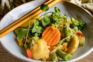 Stewed vegetables in ceramic bowls. - 788372934